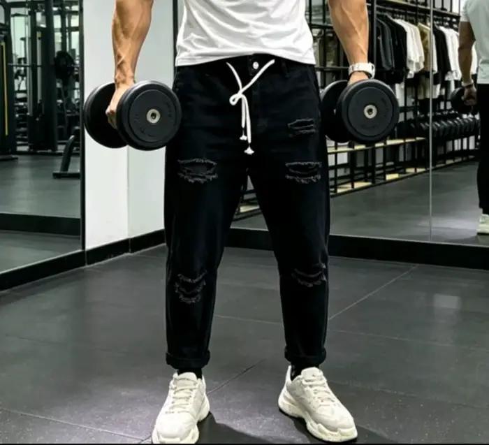 Jean vert déchiré à la cheville pour homme