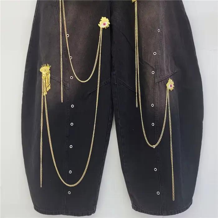 Pantalon large unisexe style urbain avec chaîne dorée décorative