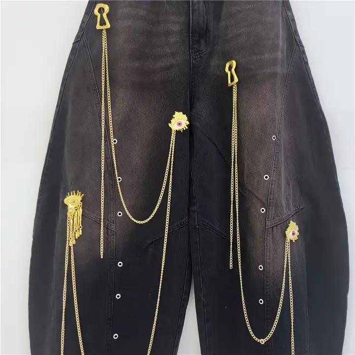 Pantalon large unisexe style urbain avec chaîne dorée décorative