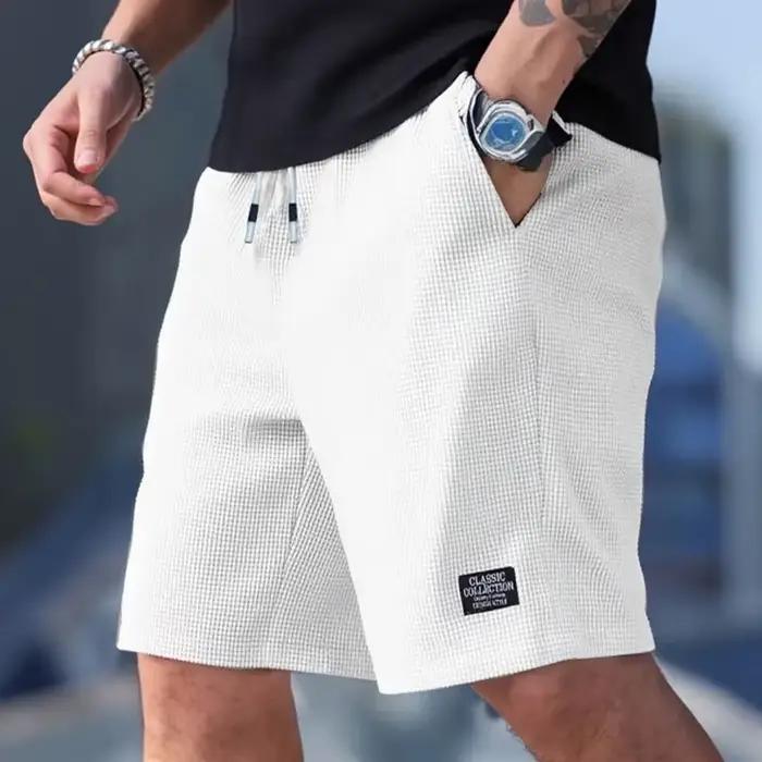 Shorts pour hommes en tissu texturé, respirants et décontractés, idéaux pour plage, sport et sorties estivales
