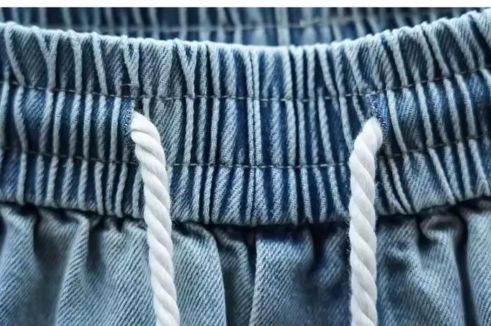 Jean Jogger Homme Style Coréen Streetwear Pantalon Harem en Denim Ample Tendance Pantalon à Taille Cordon Occasions Quotidiennes Mode Printemps Automne