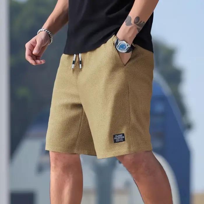 Shorts pour hommes en tissu texturé, respirants et décontractés, idéaux pour plage, sport et sorties estivales