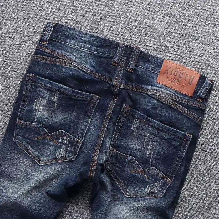 Style italien mode hommes jean rétro bleu foncé élastique coupe ajustée déchiré
