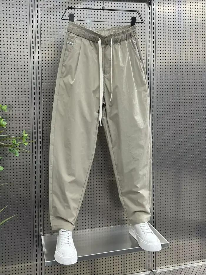 2025 printemps et automne nouveau pantalon décontracté de couleur unie ample droit polyvalent