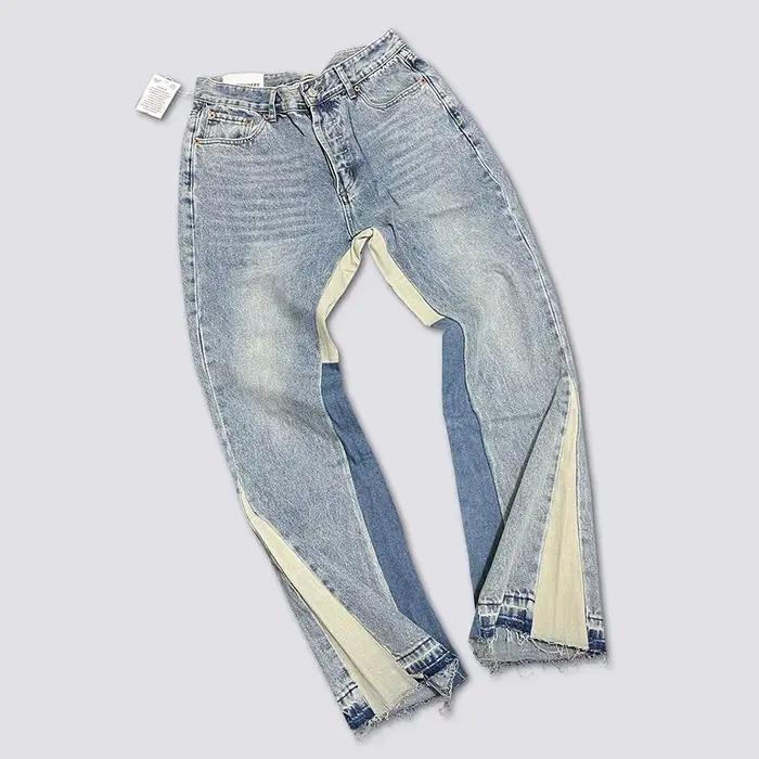 Jeans pattes d'éléphant en denim délavé et usé avec patchwork