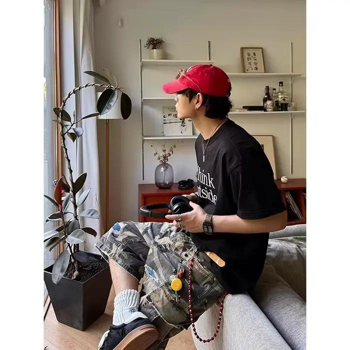 Shorts en jean déchirés à grandes poches