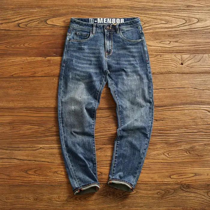 Jeans décontractés en coton bleu droit slim pour hommes avec effet usé et poches pour une élégance quotidienne
