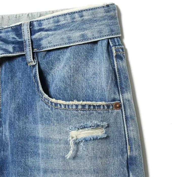 Nouvelles collections 2026 : Jean décontracté français pour femme avec détails perforés et taille mi-haute plissée