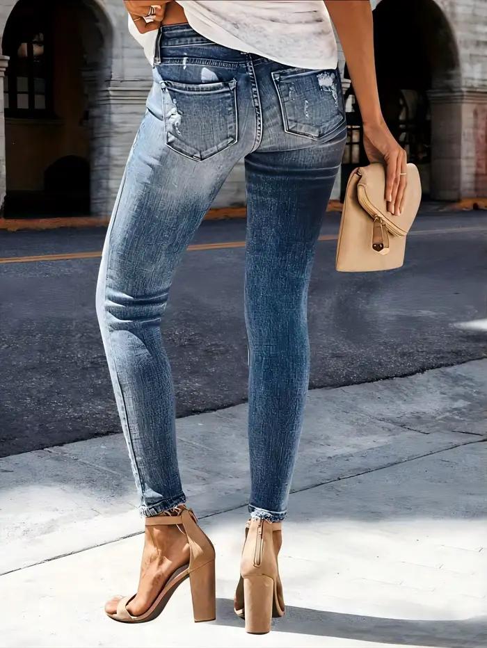 Jean slim déchiré en denim délavé à motif barbe de chat