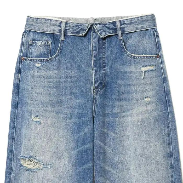 Nouvelles collections 2026 : Jean décontracté français pour femme avec détails perforés et taille mi-haute plissée