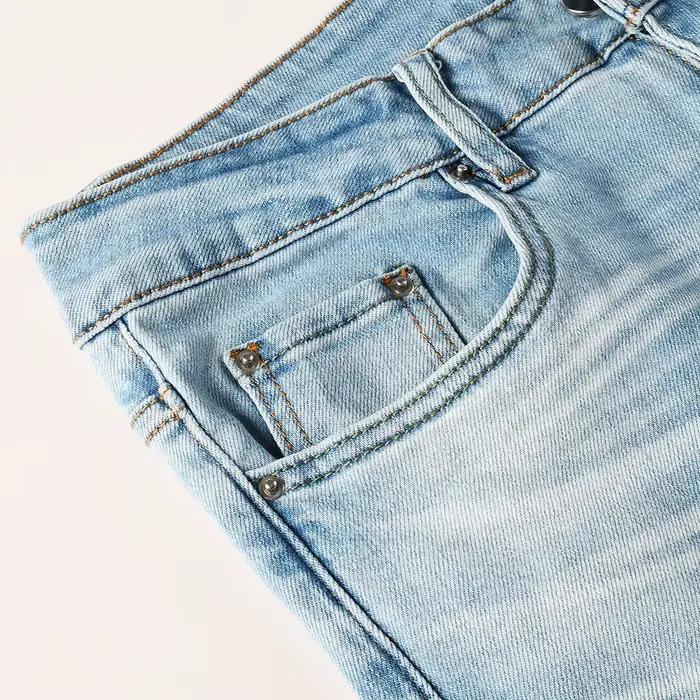 Jeans en denim coupe bootcut bleu clair pour homme