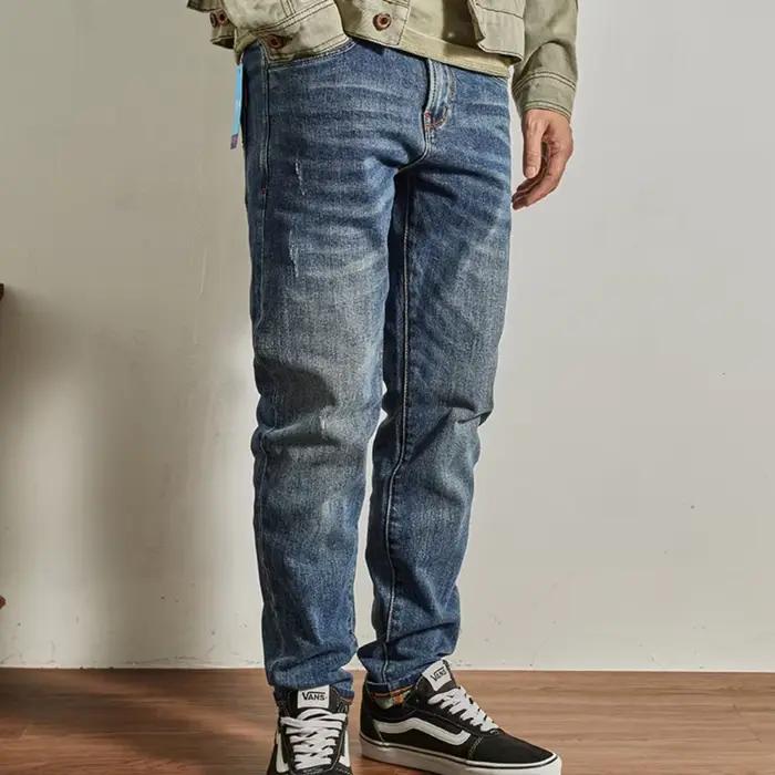 Jeans décontractés en coton bleu droit slim pour hommes avec effet usé et poches pour une élégance quotidienne