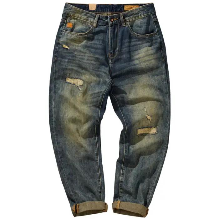 Jean ample à jambe droite pour homme avec trous patchés et lavage en détresse