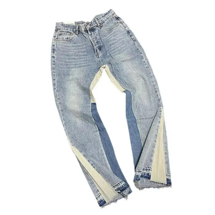 Jeans pattes d'éléphant en denim délavé et usé avec patchwork